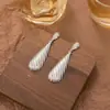 Pendientes de gota de agua de moda estilo simple Pendientes de textura geométrica retro de alta gama Pendientes de diseño nicho