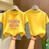 Linda camiseta básica de manga larga para niñas, colección primavera/otoño 2026, camiseta elegante de cuello redondo, algodón puro, aspecto en capas, para niños de talla mediana y grande