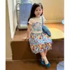 Conjunto Súper Estiloso de Niña Estilo Coreano Verano 2026 Nuevo Modelo, Moda de Top con Estampado de Manga Corta y Falda Floral de Moda para Niñas Pequeñas
