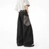 Jeans negros retro de estilo americano para el día a día, con pierna curva, diseño de patchwork estampado de serpiente, bolsillos grandes y estilo workwear de pierna ancha para hombres y mujeres