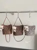 Bolso tipo cubo retro de estampado de leopardo de nicho estilo coreano de alta moda, nuevo de otoño 2026, bandolera minimalista Maillard personalizada