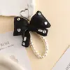 Nuevo Collar de Perlas Lazo Diamante Brillante Tridimensional Relleno Colorido Colgante para Teléfono Móvil Bolso de Nicho Colgante para Llaves