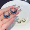 Diseño de nicho de Corea del Sur hebilla redonda de metal para oreja nuevo estilo para mujer estilo frío pequeña cesta pendientes retro joyería para oreja