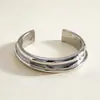 Pulsera abierta de metal con textura brillante transfronteriza europea y americana, estilo coreano ins de lujo ligero de alta gama, joyería versátil al por mayor