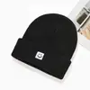 Chapéu de Tricô Novo Estilo Coreano de Rosto Sorridente de Inverno, Gorro de Lã Unissex Versátil de Cor Sólida, Chapéu de Rosto Sorridente Quente e Fashionável Tendência