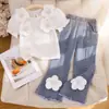 26 Fornecimento Exclusivo Transfronteiriço de Novos Conjuntos para Meninas, Camisa Três-Quartos com Estampa Floral Tridimensional da Moda + Conjunto de Duas Peças com Calça Longa Jeans