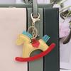 Chaveiro Cavalo de Troia em couro PU atacado chaveiro criativo chaveiro de couro carrossel pingente de cavalo de balanço