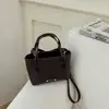 Bolso de mano de moda para el trabajo estilo coreano 2026 verano nuevo bolso cruzado de moda color liso simple nicho bolso de hombro