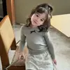 Camiseta de Manga Larga Redonda Dulce con Lazo, Estilo Coreano, Nueva para Primavera/Otoño, Color Sólido Versátil, Capa Base, Moderna, para Niñas Bebé