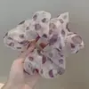 Nueva versión coreana del anillo para el cabello de perlas, sencillo, moderno, de tela, anillo para el cabello de intestino grueso, cuerda para el cabello con bola de cola de caballo, fabricantes, venta al por mayor