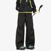 Pantalones de Concha Impermeables para Exteriores con Costuras de Contraste Negras Bolsillos con Cremallera Fluorescente Cordón Pierna Ancha Pantalones Largos Impermeables para Montañismo Unisex