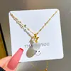[Acero de titanio] Collar de manzana con ojo de gato y diamantes de oro real con microincrustaciones para mujer, nueva cadena de clavícula, diseño de nicho de lujo ligero.