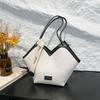 Venta al por mayor, bolso pequeño portátil de tejido en contraste de color, bolso de mujer, primavera 2025, nuevo bolso de hombro de gran capacidad, bolso de viaje bajo el brazo