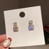 Pendientes Pequeños Estilo Chanel de Aguja de Plata 925 Lujo Ligero Pendientes de Perlas de Gama Alta Medio Antiguo Nuevo Pendientes Elegantes Europeos y Americanos Venta al por Mayor