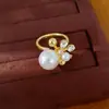 Anillo abierto de flor de perla incrustado con circonita y diamante, sensación de nicho de alta gama, joyería exquisita de estilo palaciego de lujo ligero al por mayor