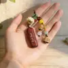 Colgante Llavero Cuerno de Rinoceronte Palo de Rosa Cadena para Bolso de Teléfono Móvil Hombres y Mujeres Colgante de Productos de Madera Creativos Joyería