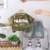 Conjunto de Verano de Moda para Niños 2026 Estilo Coreano Tendencia Bolsillo de Ropa de Trabajo de Manga Corta Conjunto de Cuello Redondo Ropa de Moda