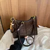 Moda estilo coreano design retrô de nicho bolsa de axila 2026 novo estilo artístico de nicho bolsa de ombro único transversal