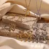 Colar de Personalidade Criativa Transfronteiriço Europeu e Americano Aço Inoxidável Banhado a Ouro 18K Pingente Doce de Laço com Strass Brincos Anel