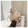Bolsa Pequena Fofa para Mulheres 2026 Novo Modelo Bolsa de Ombro Transversal para o Dia a Dia Bolsa Estilo Bowling de Nicho de Alto Padrão