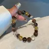 Pulsera de obsidiana cristal amarillo natural con cuentas de madera de agar, un diseño de lujo ligero, pulsera de regalo