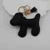 Colgante de bolsa de borla de cachorro relleno, accesorio de llavero de cachorro de cuero PU creativo y moderno para coche, correa para teléfono