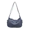 Bolsa de lona transfronteriza para mujer, nuevo modelo 2026, bolso de hombro casual versátil, bolso cruzado deportivo ligero de moda para el trabajo