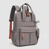 Bolso de mano casual para viajar, bolsa multifuncional para el día a día, mochila de color liso estilo outdoor, mochila de viaje ligera e impermeable