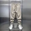 Nuevos pantalones deportivos casuales de otoño e invierno para hombre, de corte holgado, modernos, elegantes, sencillos, versátiles y adecuados para estudiantes, con un diseño de pierna cónica