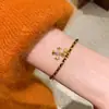 Pulsera de Cuerda Tejida Negra Retro Francesa de Lujo Ligero Pequeña Cruz de Amor Nicho Moda Elegante Combinable Joyería Exquisita