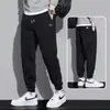 Pantalones térmicos con forro polar transfronterizos, nuevo estilo otoño/invierno, nuevos pantalones deportivos, pantalones de chándal casual para niños, pantalones jogger de corte holgado para hombre