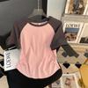 Camiseta Raglan de Manga Curta de Alta Qualidade Estilo Americano Ombro Direito para Mulheres Solta Nova Verão 2025 Cobre a Barriga, Rejuvenescedora e Emagrecedora