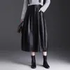 Nueva falda elegante y versátil de piel sintética, falda de paraguas, falda de capullo para mujer, otoño 2026, que reduce la edad, de longitud media, moda, falda de media pierna moderna
