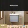 Tocador de baño engrosado y ahorrador de espacio con diseño en color crema, que cuenta con un lavabo redondeado, lavabo cerámico integrado y un lavabo de una sola pieza.