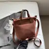 Bolso Pequeño Retro de Moda Transfronterizo para Mujer, Nuevo Bolso Cruzado para Teléfono Primavera y Otoño 2026, Bolso Cubo Marrón de Alta Gama