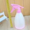 Regadera de color caramelo, hervidor de agua, pulverizador de plástico prensado a mano, regadera, 2 yuanes, tienda departamental, venta al por mayor
