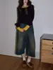 Camiseta Splicing Preta de Gola Redonda para Mulheres Outono 2025 Top Elegante de Alta Qualidade com Efeito Afinando a Cintura Manga Longa