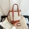 Bolso cubeta de colores contrastantes popular de este año para mujer 2026 nuevo bolso de mano de moda nicho bolso de hombro sensación de alta gama bolso cruzado