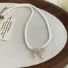 Collar de Perlas con Lazo Suave Estilo Coreano Moda Femenina Elegante Nicho Gama Alta Versátil para el Trabajo Dulce Cadena para la Clavícula