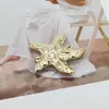 Hebilla decorativa de metal con forma de estrella de mar, estilo europeo y americano transfronterizo, conector de tirante para traje de baño de alta gama, hebilla para bufanda, hebilla de ajuste para cinturón