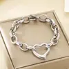 Pulsera de acero inoxidable con forma de corazón hueco personalizada, moda transfronteriza europea y americana, pulsera de cadena O geométrica de corazón de moda INS