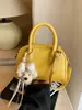 Bolso de Mano Minimalista Boston 2026 Modelo Nuevo Bolso de Bowling de Gama Alta Versátil de Nicho Bolso Cuadrado Pequeño Bolso Cruzado