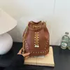 Bolso de hombro retro de gran capacidad transfronterizo para mujer, nuevo bolso cubo casual simple de verano 2026, bolso bandolera para debajo del brazo