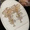Pendientes de borla de flor de cuentas de color dopamina para primavera, sensación de lujo ligero y alta gama, pendientes atmosféricos estilo vacacional para mujer