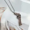 Pistola Pequeña de Pollo Elite de la Paz Mini QBZ95 Modelo de Aleación Arma de Metal 95 Juguete Adornos Llavero