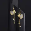 Aretes de bolsa de la suerte de piedra ojo de gato sintético para mujer, aretes de borla de moneda estilo chino de lujo ligero, aretes de calcita anti moda temperamento