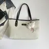 Bolso de mano de moda transfronterizo, bolso tote, nuevo bolso de hombro retro minimalista para commuting, bolso de mujer casual de personalidad para distancias cortas