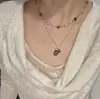 Collar Colgante de Piedra Ojo de Tigre Bañado en Oro Real Cadena de Clavícula Retro Maillard Joyería Versátil de Gama Alta de Nicho