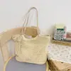 Bolso de playa tejido estilo vacacional para mujer 2026 Nuevo Versátil Gran capacidad Hombro Viajero Bolso tote de playa