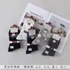Envío gratis calcetines de invierno de cintura alta desodorantes anti-pilling doble aguja antibacterianos para hombre y mujer mercado mayorista comparable